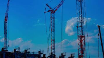 A timelapse of cranes at the under construction in Tokyo video