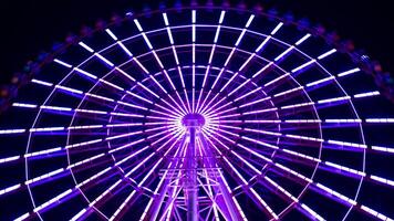 A timelapse of ferris wheel at the amusement park in Tokyo at night video