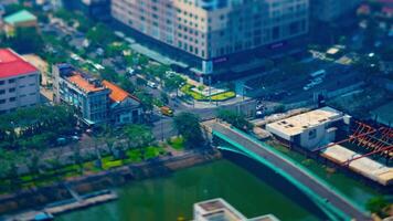 A timelapse of miniature traffic jam at the busy town in Ho Chi Minh high angle zoom video