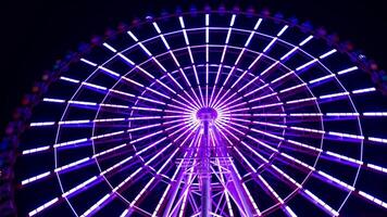 A timelapse of ferris wheel at the amusement park in Tokyo at night video