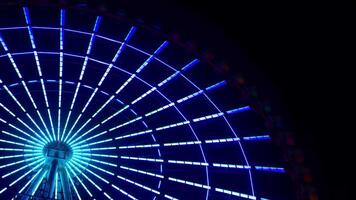 A timelapse of ferris wheel at the amusement park in Tokyo at night video