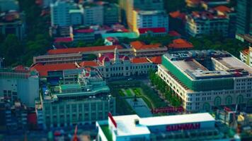 A timelapse of miniature traffic jam at Ho Chi Minh People's Committee Office Building high angle titlshift video