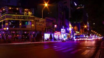 A night timelapse of the neon downtown at Bui Vien street in Ho Chi Minh Vietnam wide shot video