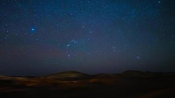 A timelapse of starry sky at Sahara desert in Morocco wide shot zoom video