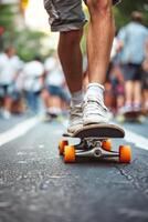 Teenager s foot on skateboard in urban street scene with blurred pedestrians in background photo