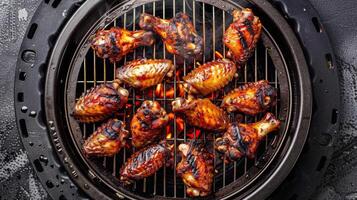 Crispy golden chicken wings frying in sizzling oil, skin glistening with a tempting golden brown hue photo