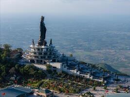 View of Ba Den mountain tourist area, Tay Ninh province, Vietnam. A unique Buddhist architecture with the highest elevation in the area view from below is very beautiful. photo