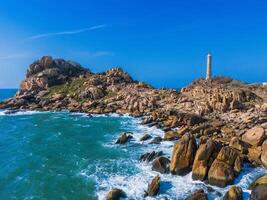 Aerial view of Ke Ga beach at Mui Ne, Phan Thiet, Binh Thuan, Vietnam. Ke Ga Cape or lighthouse is the most favourite destination for visitors. photo