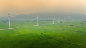 view of turbine green energy electricity, windmill for electric power production, Wind turbines generating electricity on rice field at Phan Rang, Ninh Thuan province, Vietnam photo