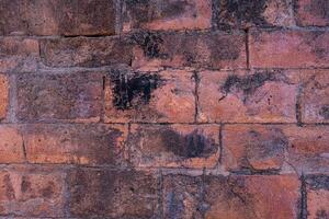 Close up vintage red and brown brick wall background. Grunge background. photo
