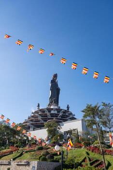 View of Ba Den mountain tourist area, Tay Ninh province, Vietnam. A unique Buddhist architecture with the highest elevation in the area view from below is very beautiful. photo
