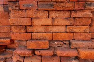 Close up vintage red and brown brick wall background. Grunge background. photo