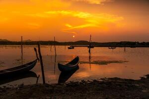 Traditional boats at O Loan lagoon in sunset, Phu Yen province, Vietnam photo