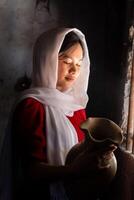 portrait of Cham ethnic girl in Bau Truc pottery village, Phan Rang city, Ninh Thuan province, Vietnam photo