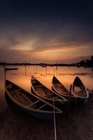 Traditional boats at O Loan lagoon in sunset, Phu Yen province, Vietnam photo