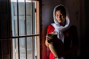 portrait of Cham ethnic girl in Bau Truc pottery village, Phan Rang city, Ninh Thuan province, Vietnam photo