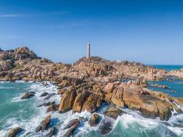 Aerial view of Ke Ga beach at Mui Ne, Phan Thiet, Binh Thuan, Vietnam. Ke Ga Cape or lighthouse is the most favourite destination for visitors. photo