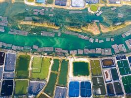 Aerial view of white shrimp, prawn, farm with aerator pump in O Loan lagoon , Phu Yen province, Vietnam photo