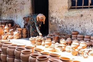 old female of Cham ethnic girl in Bau Truc pottery village, Phan Rang city, Ninh Thuan province, Vietnam. People and travel concept. photo