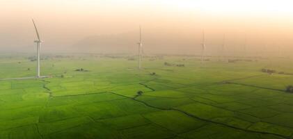 view of turbine green energy electricity, windmill for electric power production, Wind turbines generating electricity on rice field at Phan Rang, Ninh Thuan province, Vietnam photo
