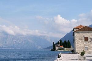 View from the island of Gospa od Skrpjela to the island of St. George. Montenegro photo