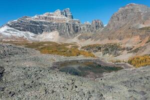 Aerial view of Wenkchemna Peak and Eiffel Lake in autumn. photo