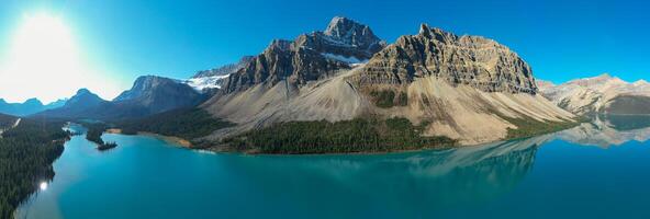 Panoramic aerial view of Crowfoot Mountain in autumn with snow. photo