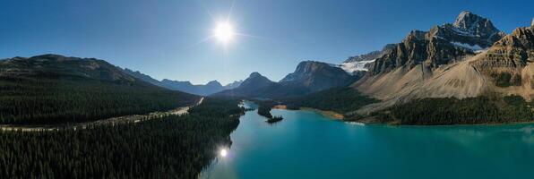 Incredible Panoramic aerial view of Bow Lake with the reflection of the mountains. photo