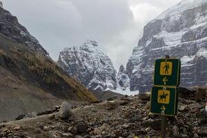 Trail sign that marks two paths, one path for hikers and another for horses. photo