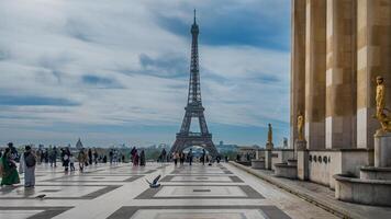 Tourists exploring Trocadero Gardens with Eiffel Tower backdrop on a spring day in Paris, France, symbolizing travel and European landmarks, captured April 14th, 2024 photo