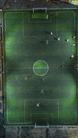 Aerial view of mini football match, soccer. MiniFootball field and Footballers from drone photo