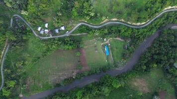 Aerial view of a small river in the middle of the jungle photo