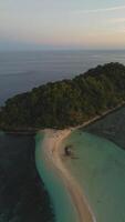 Aerial View of a Beautiful Tropical Island with White Sand Beach and Turquoise Sea photo