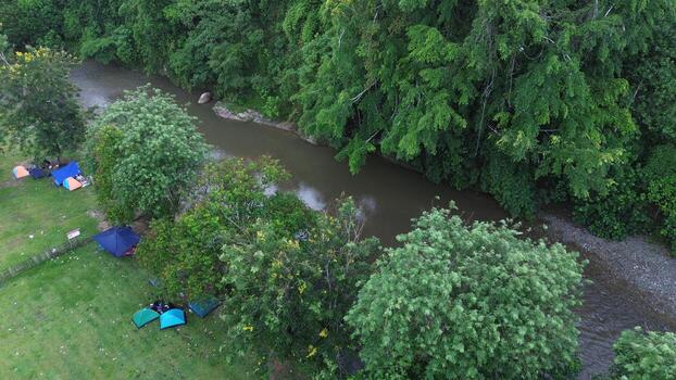 Aerial view of a small river in the middle of the jungle photo