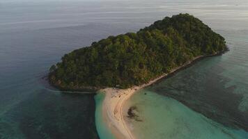 Aerial View of a Beautiful Tropical Island with White Sand Beach and Turquoise Sea photo