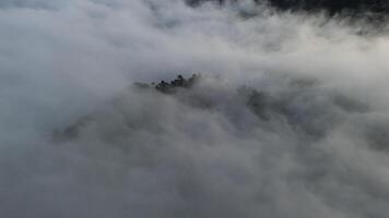 Aerial view of fog in the mountain at Gorontalo, Indonesia. Sunrise over the clouds in the morning photo