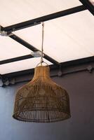 Straw lampshade in modern living room. Eco-friendly interior design using natural materials. photo