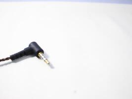 Black power cable with plug isolated on white background photo