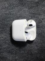 Closeup white TWS true wireless stereo earbuds in case isolated on black background. photo