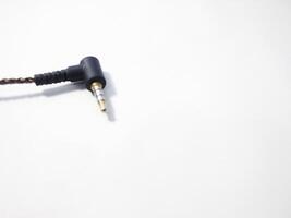 Black power cable with plug isolated on white background photo