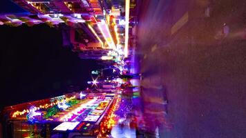 A night timelapse of the neon downtown at Bui Vien street in Ho Chi Minh Vietnam vertical shot zoom video