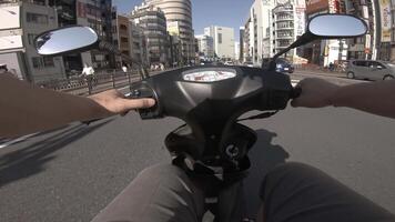 A point of view of driving by bike at the business street in Shinjuku video