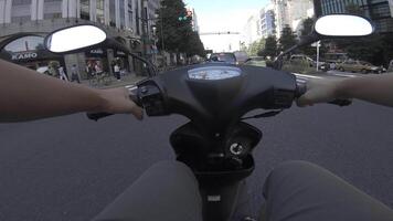 A point of view of driving by bike at the business street in Shinjuku video
