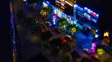 A night timelapse of miniature neon town at Nguyen Hue street in Ho Chi Minh tiltshift panning video