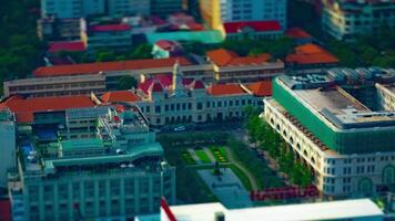 A timelapse of miniature traffic jam at Ho Chi Minh People's Committee Office Building high angle titlshift zoom video