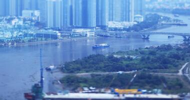 A high angle view of miniature cityscape at Saigon river in Ho Chi Minh tiltshift video