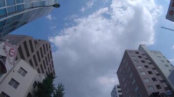 A moving cityscape of the buildings at the downtown in Tokyo low angle video