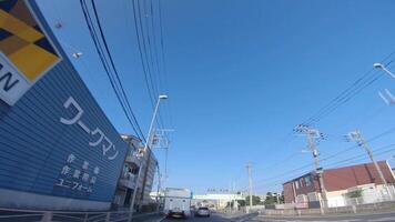 A moving cityscape at the downtown avenue in Kanagawa wide shot video