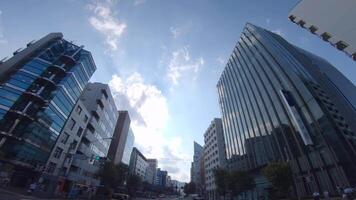 A moving cityscape at the downtown in Shinjuku Tokyo by low angle video