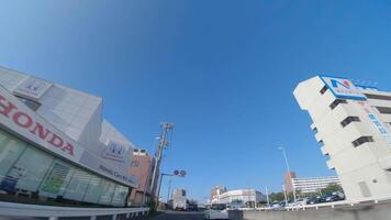 A moving cityscape at the downtown avenue in Kanagawa wide shot video